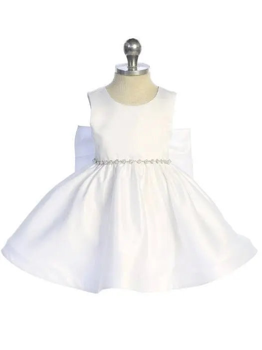 Vestido blanco de bebé con moño